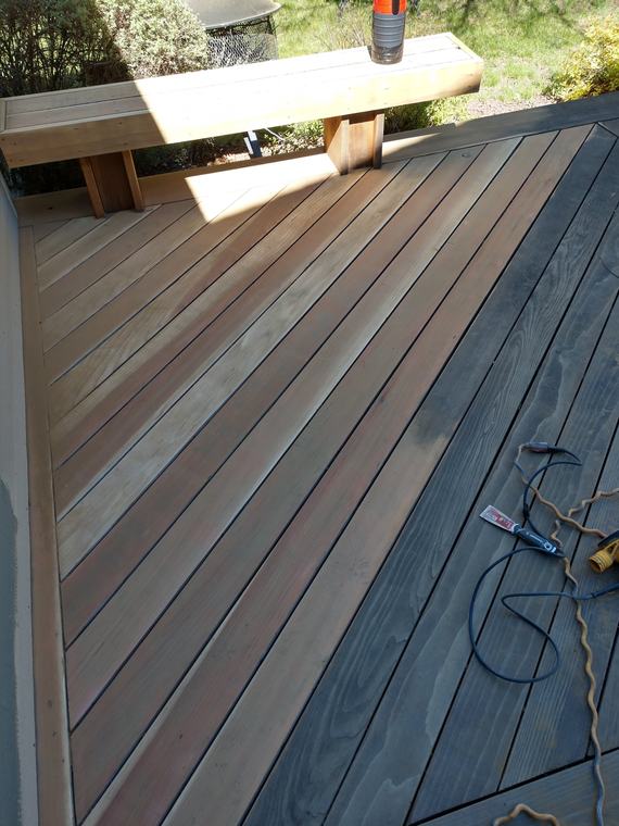 Weathered gray deck boards before stripping and sanding