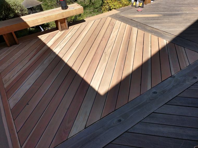 Deck partially stripped back to bare wood