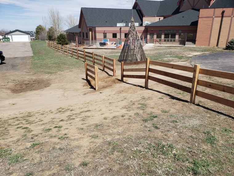 Split-rail fence line on a commercial property