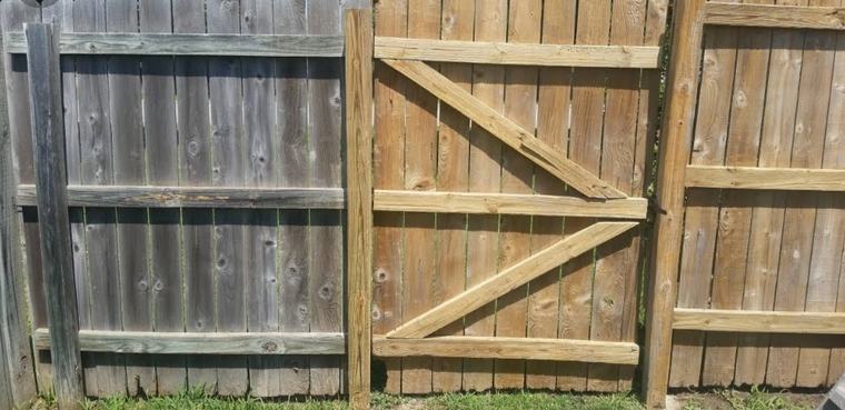 Rebuilt braced fence gate next to the original weathered panel